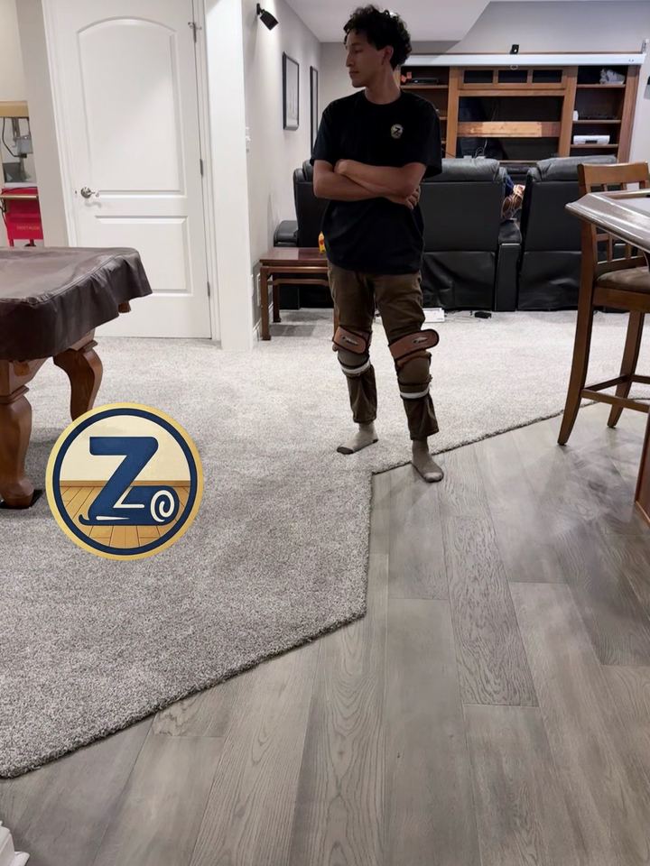 Irvin on a finished Geist basement, carpet meeting LVP on a hand-cut border
