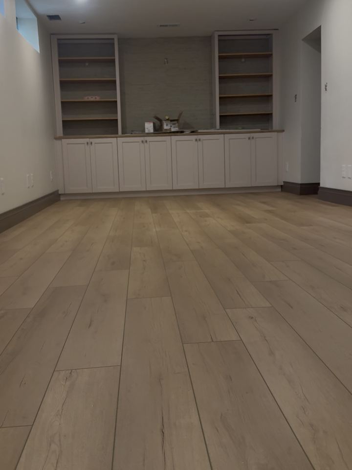 After: Coretec Calypso Oak LVP across the finished basement near the Indiana State Fairgrounds, Indianapolis
