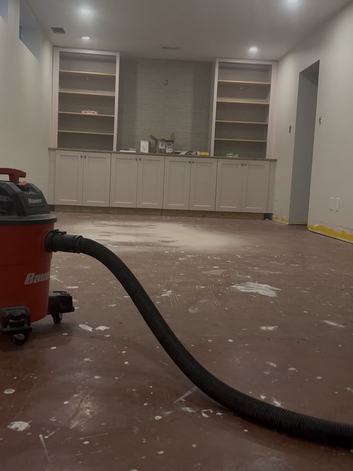 Before: finished basement with built-ins, slab swept and ready for plank, Indianapolis